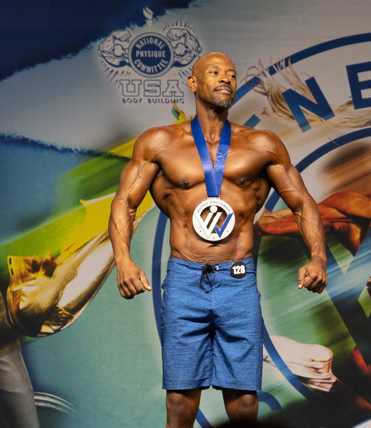 Dev on stage at his bodybuilding competition